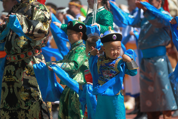 Performers take part in the opening ceremony of the year's Naadam Festival in Xinlin Gol, situated on the grasslands of the Inner Mongolia autonomous region, Aug 8, 2013. 
