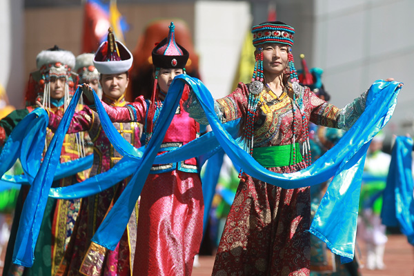 Performers take part in the opening ceremony of the year's Naadam Festival in Xinlin Gol, situated on the grasslands of the Inner Mongolia autonomous region, Aug 8, 2013.