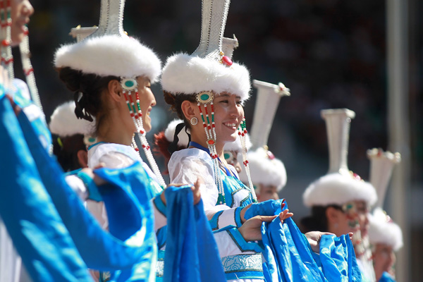 Performers take part in the opening ceremony of the year's Naadam Festival in Xinlin Gol, situated on the grasslands of the Inner Mongolia autonomous region, Aug 8, 2013.