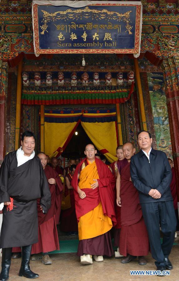 The 11th Panchen Lama Bainqen Erdini Qoigyijabu (C), who is also a member of the Standing Committee of the Chinese People's Political Consultative Conference (CPPCC) National Committee, visits the Sera Monastery for pilgrimage in Lhasa, capital of southwest China's Tibet Autonomous Region, July 3, 2014. The Panchen Lama made a research and inspection tour in Lhasa in recent days. [Photo/Xinhua]