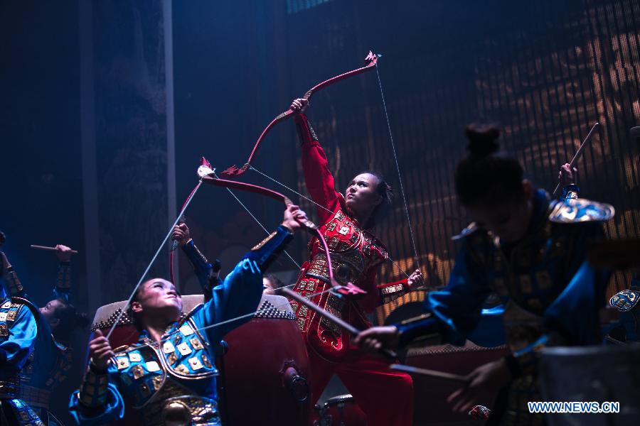 China's female percussion group, Red Poppy Ladies, auditions part of 'Mulan the Musical' for media in New York, the United States, on June 30, 2014. This is the second time the musical be put on stage in New York. [Photo/Xinhua]