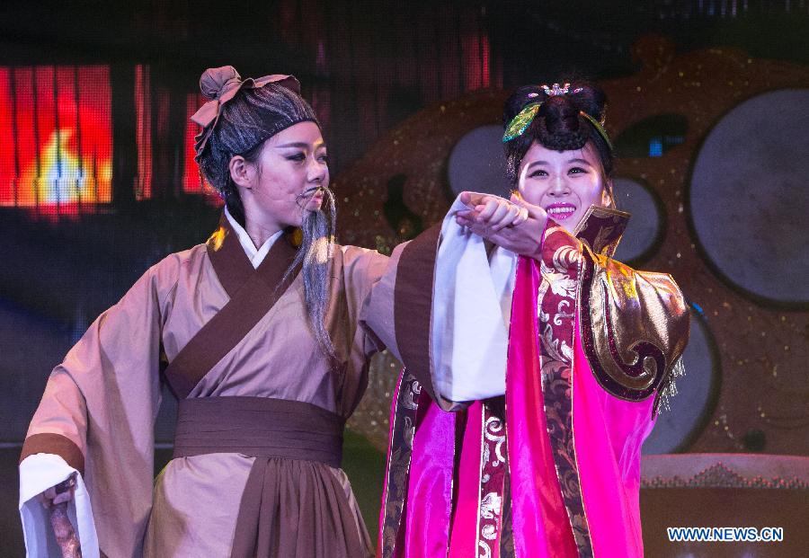 China's female percussion group, Red Poppy Ladies, auditions part of 'Mulan the Musical' for media in New York, the United States, on June 30, 2014. This is the second time the musical be put on stage in New York. [Photo/Xinhua]