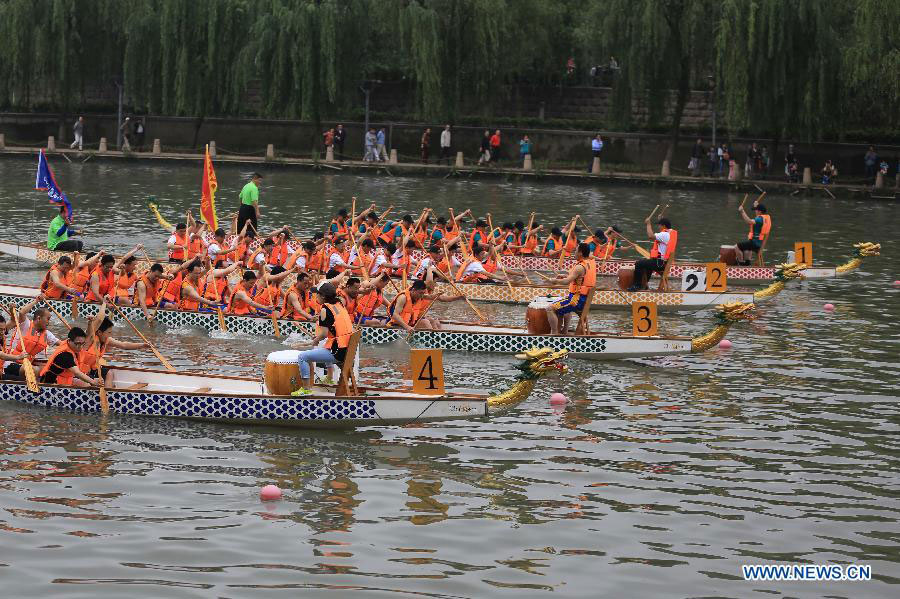 Dragon boats race on Qinhuai River in Nanjing