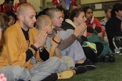 European Shaolin disciples pray at the closing ceremony of Shaolin Cultural Festival in London, UK on Oct 12, 2014. [Photo/Xinhua]